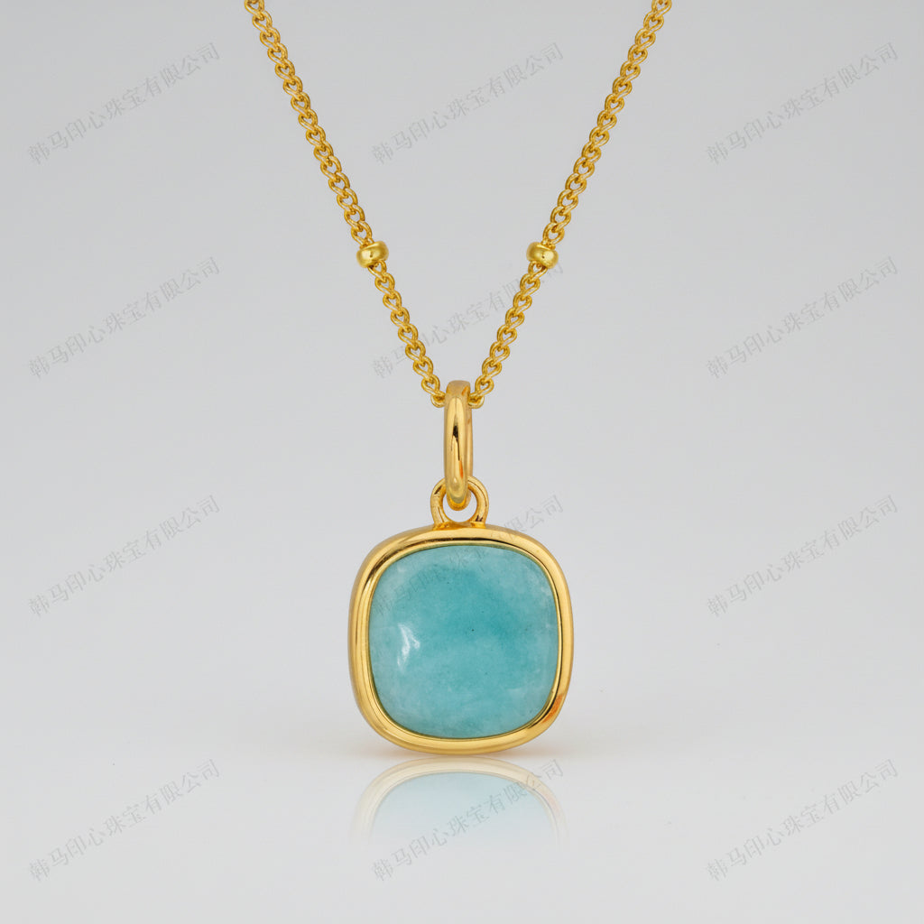 Gold plated chain necklace with a amazonite blue stone pendant 